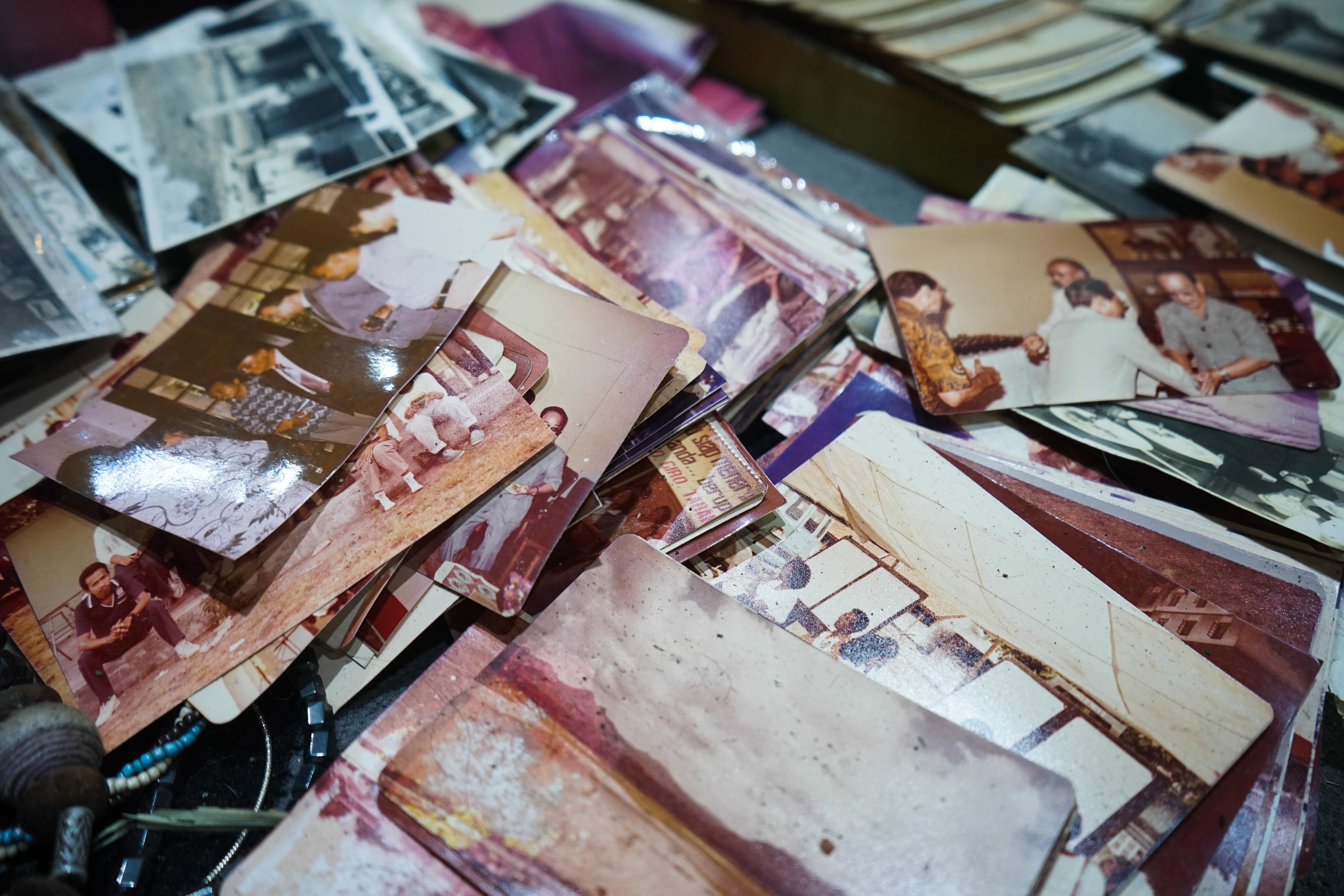 Family gathering sharing old photographs